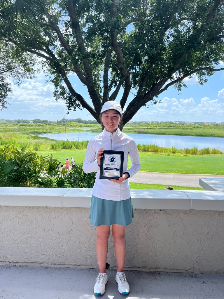 Ciana with a Hurricane Junior Golf Tour third-place plaque, Tampa 2018