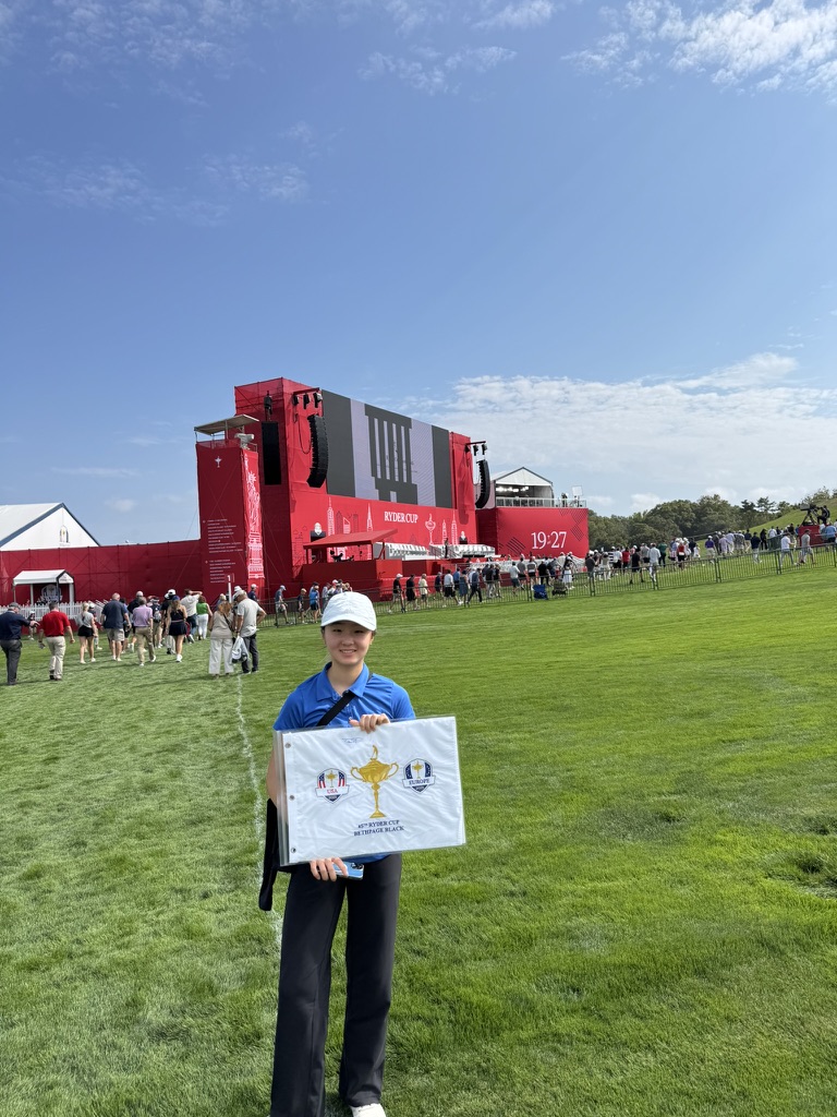 Ciana holding a 45th Ryder Cup flag at Bethpage Black
