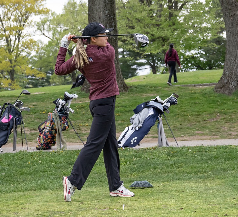 Ciana in the follow-through of a drive